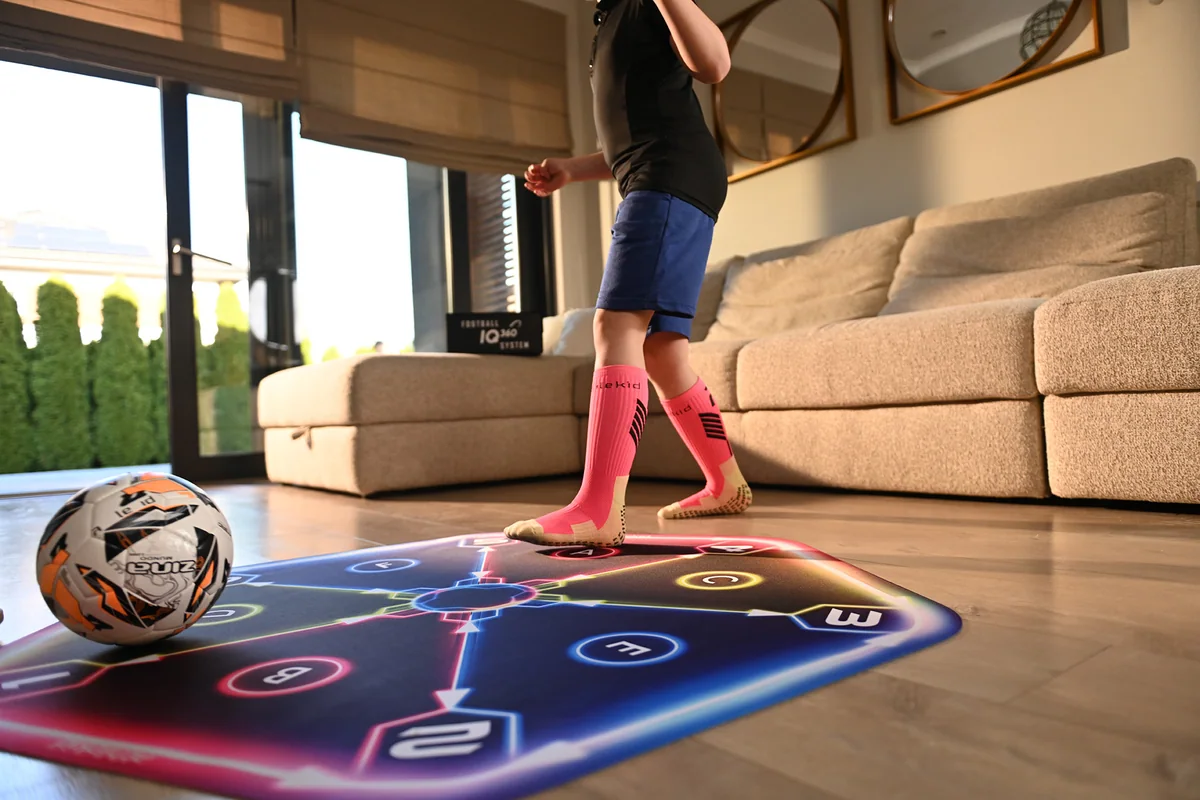 A child training alone on the mat in a living room