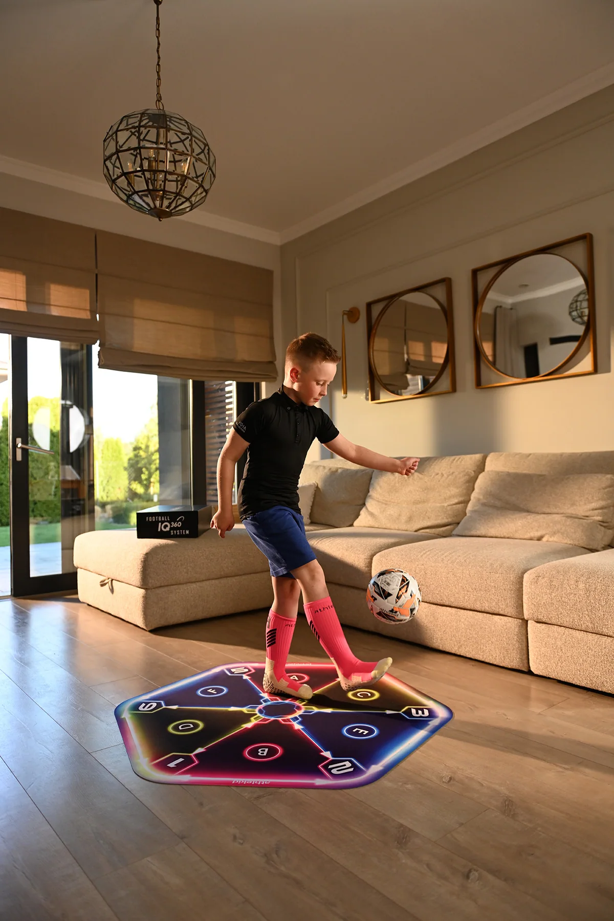 The full mat unrolled in a living room with a child training on it