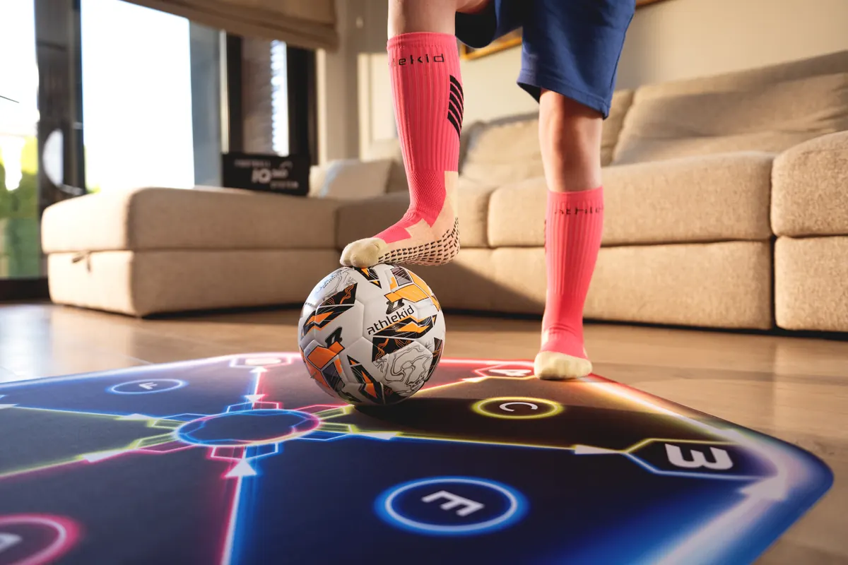 A close-up of a ball on the Athlekid training mat